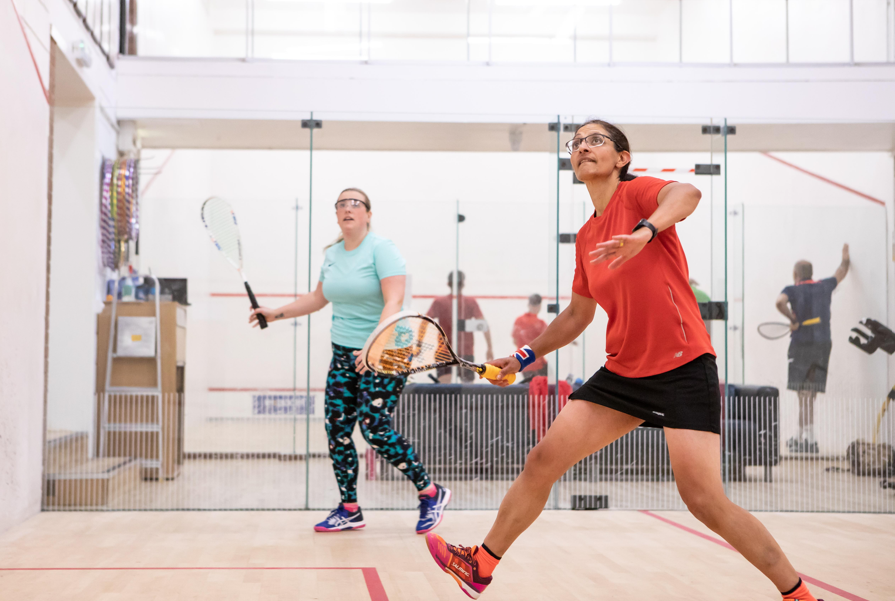 Women playing squash